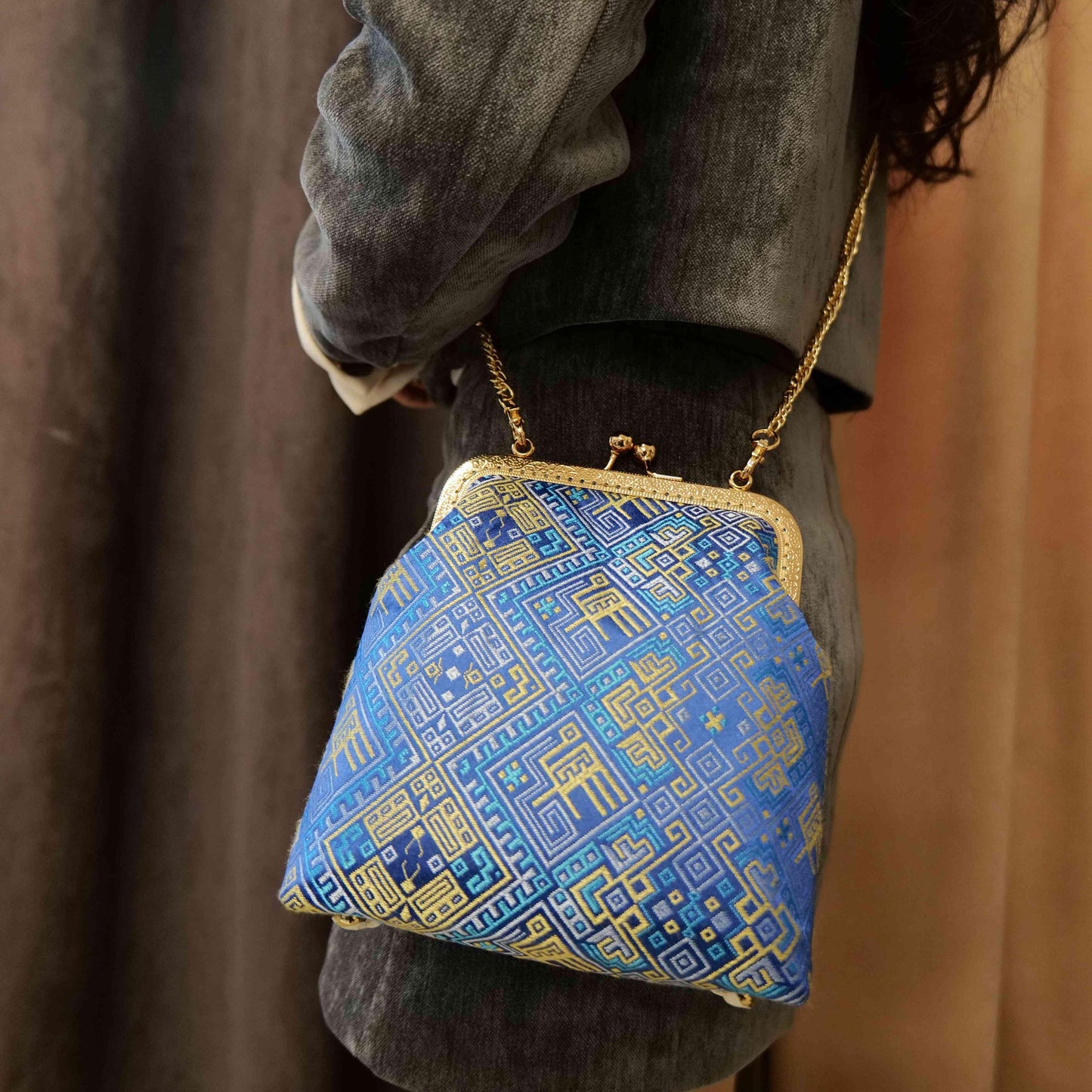 Guangxi Zhuang Brocade Clutch Bag with Smooth Leather Shoulder Strap