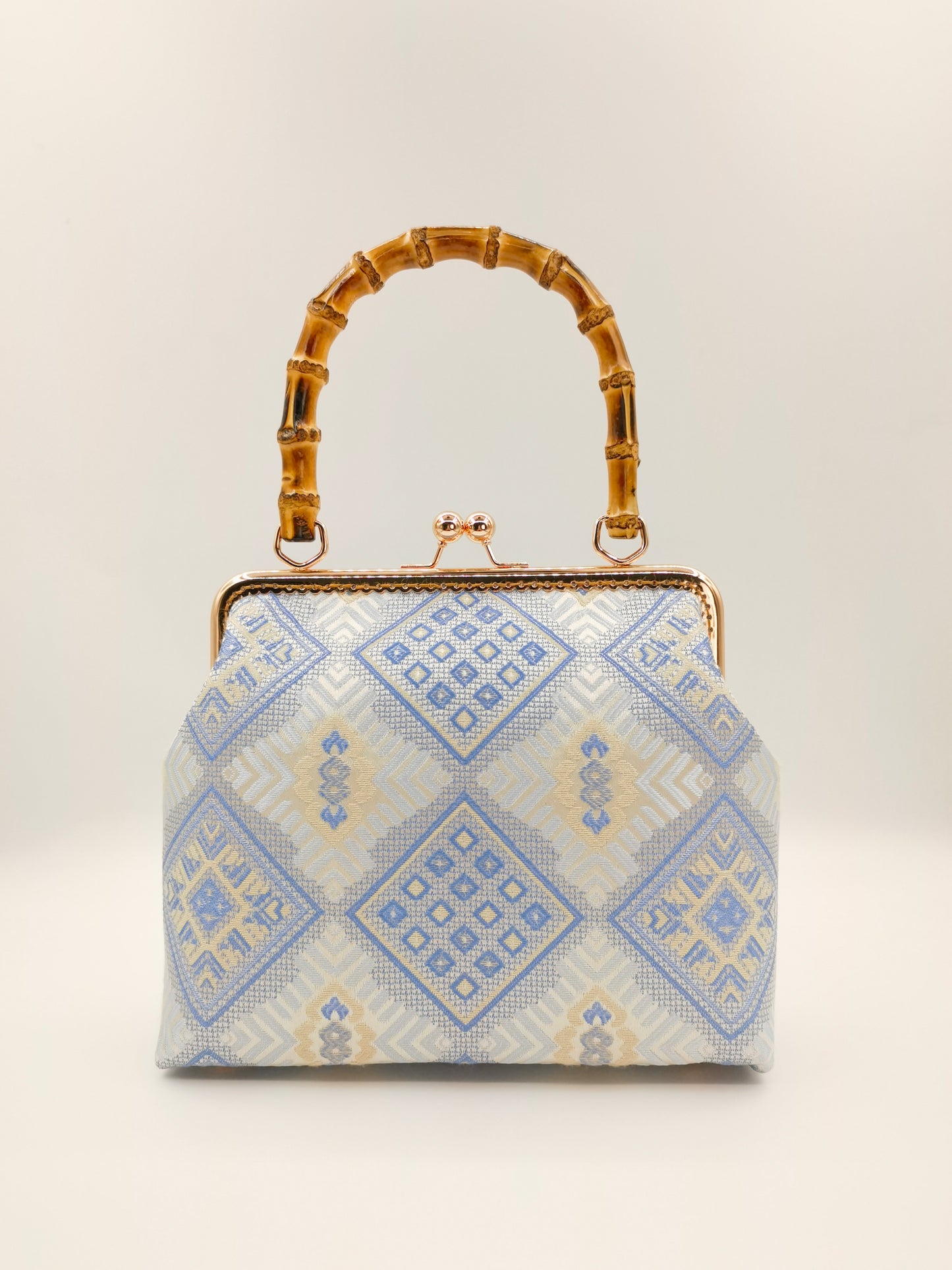 Guangxi Zhuang Brocade Handbag with Gold-Trimmed Bamboo Handle