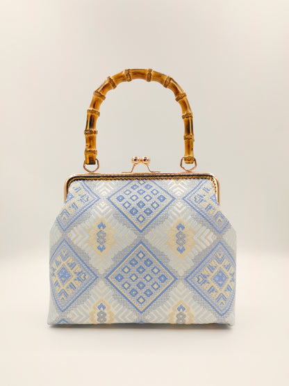Guangxi Zhuang Brocade Handbag with Gold-Trimmed Bamboo Handle