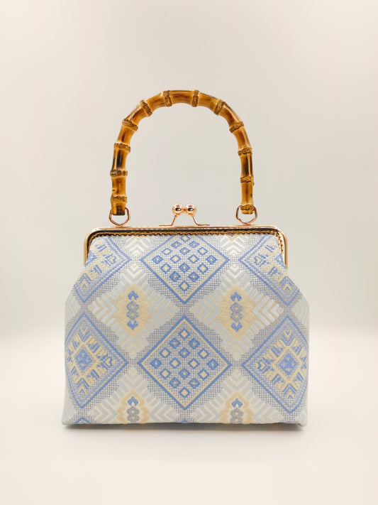 Guangxi Zhuang Brocade Handbag with Gold-Trimmed Bamboo Handle