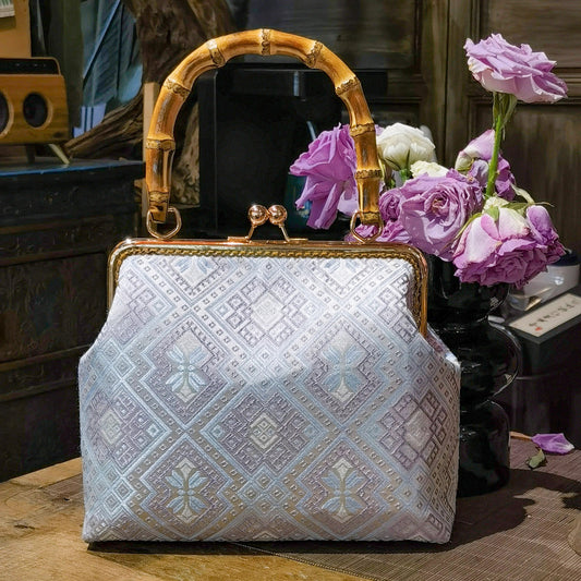 Guangxi Zhuang Brocade Handbag with Gold-Trimmed Bamboo Handle