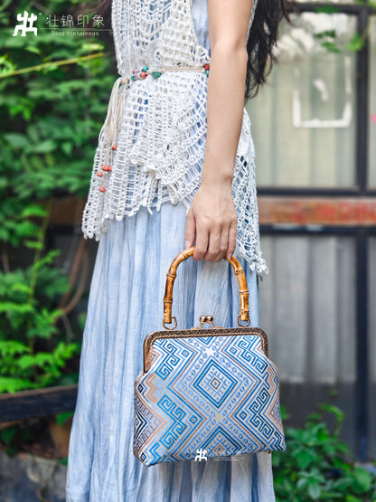Guangxi Zhuang Brocade Handbag with Gold-Trimmed Bamboo Handle