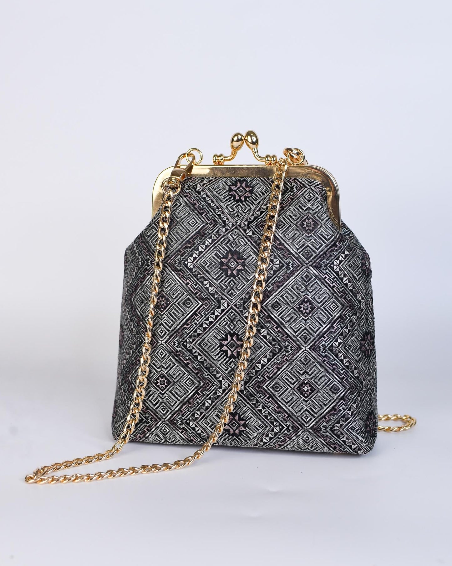 Guangxi Zhuang Brocade Clutch Bag with Smooth Leather Shoulder Strap