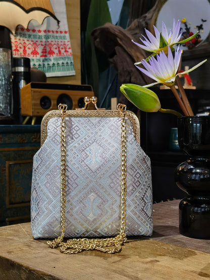 Guangxi Zhuang Brocade Clutch Bag with Smooth Leather Shoulder Strap