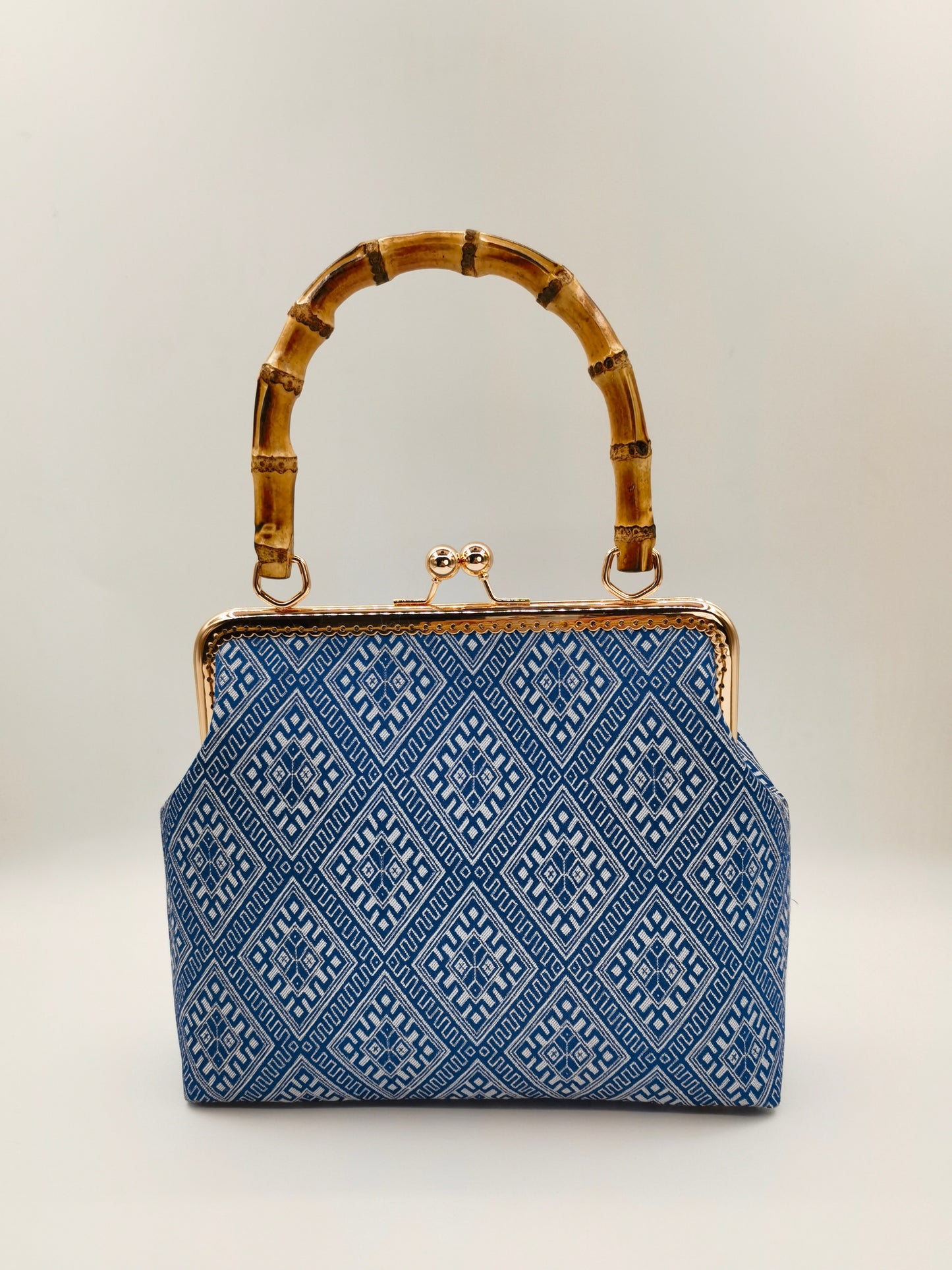 Guangxi Zhuang Brocade Handbag with Gold-Trimmed Bamboo Handle