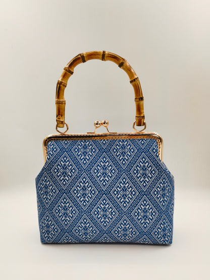 Guangxi Zhuang Brocade Handbag with Gold-Trimmed Bamboo Handle