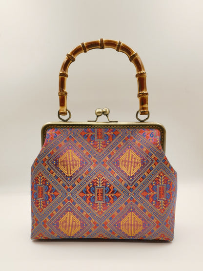 Guangxi Zhuang Brocade Handbag with Gold-Trimmed Bamboo Handle