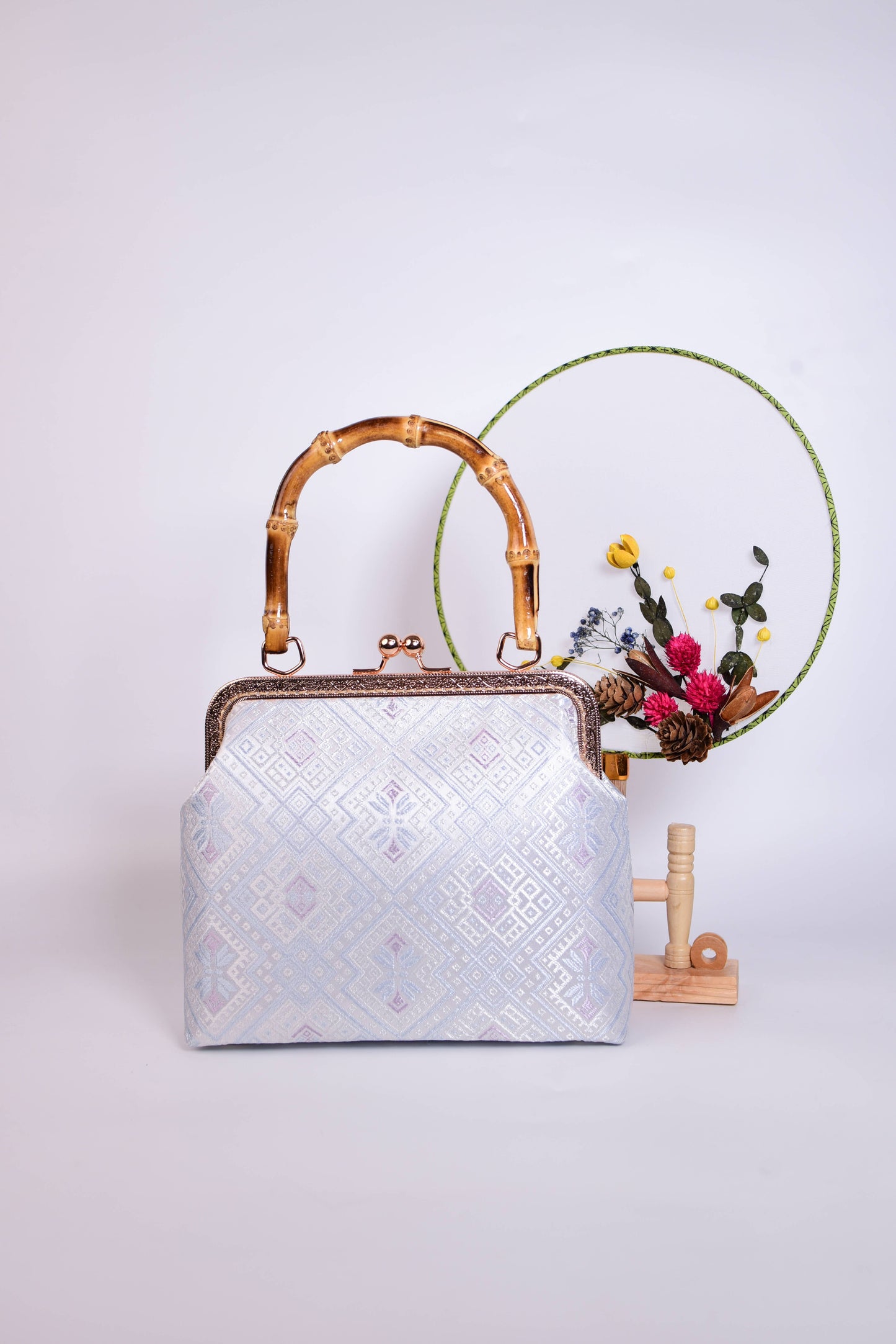 Guangxi Zhuang Brocade Handbag with Gold-Trimmed Bamboo Handle